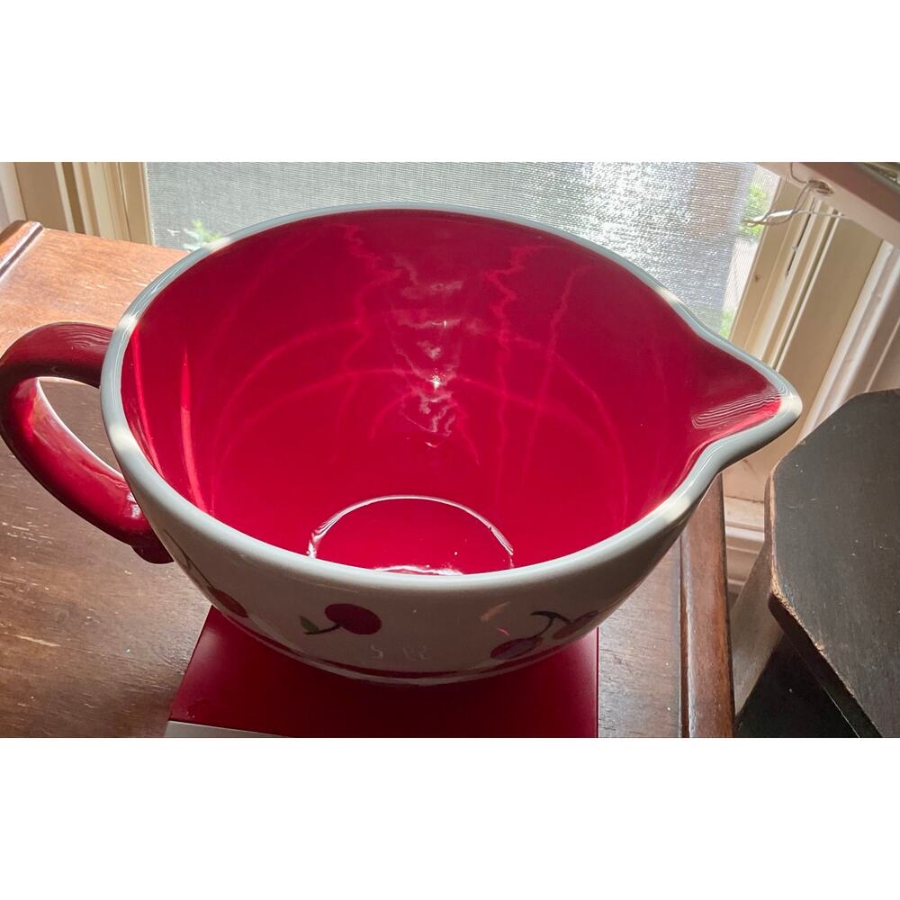 Cherry red mixing bowl handle cherries batter